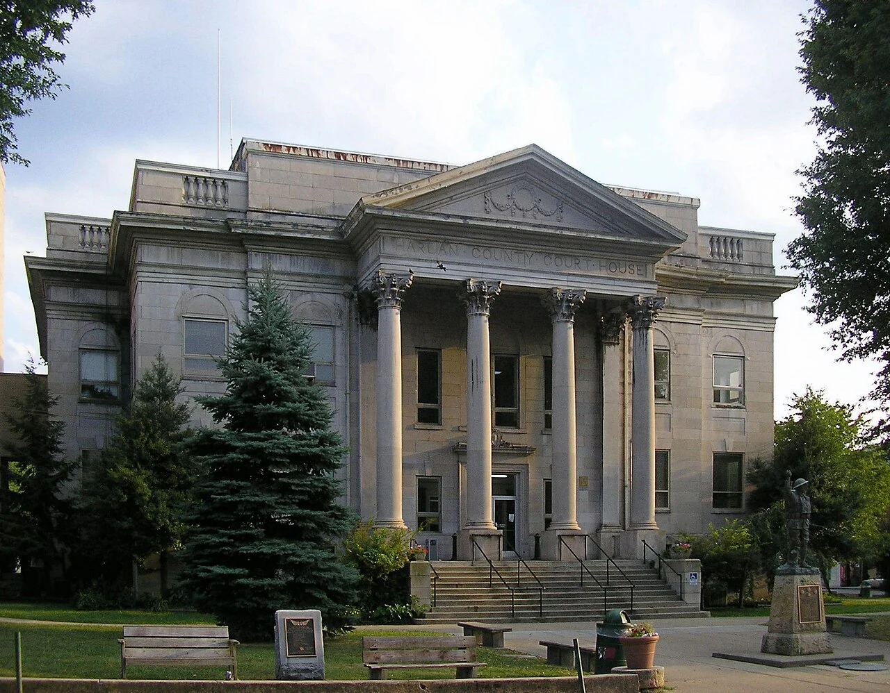 The stone columns and broad front steps of the Harlan County Courthouse.