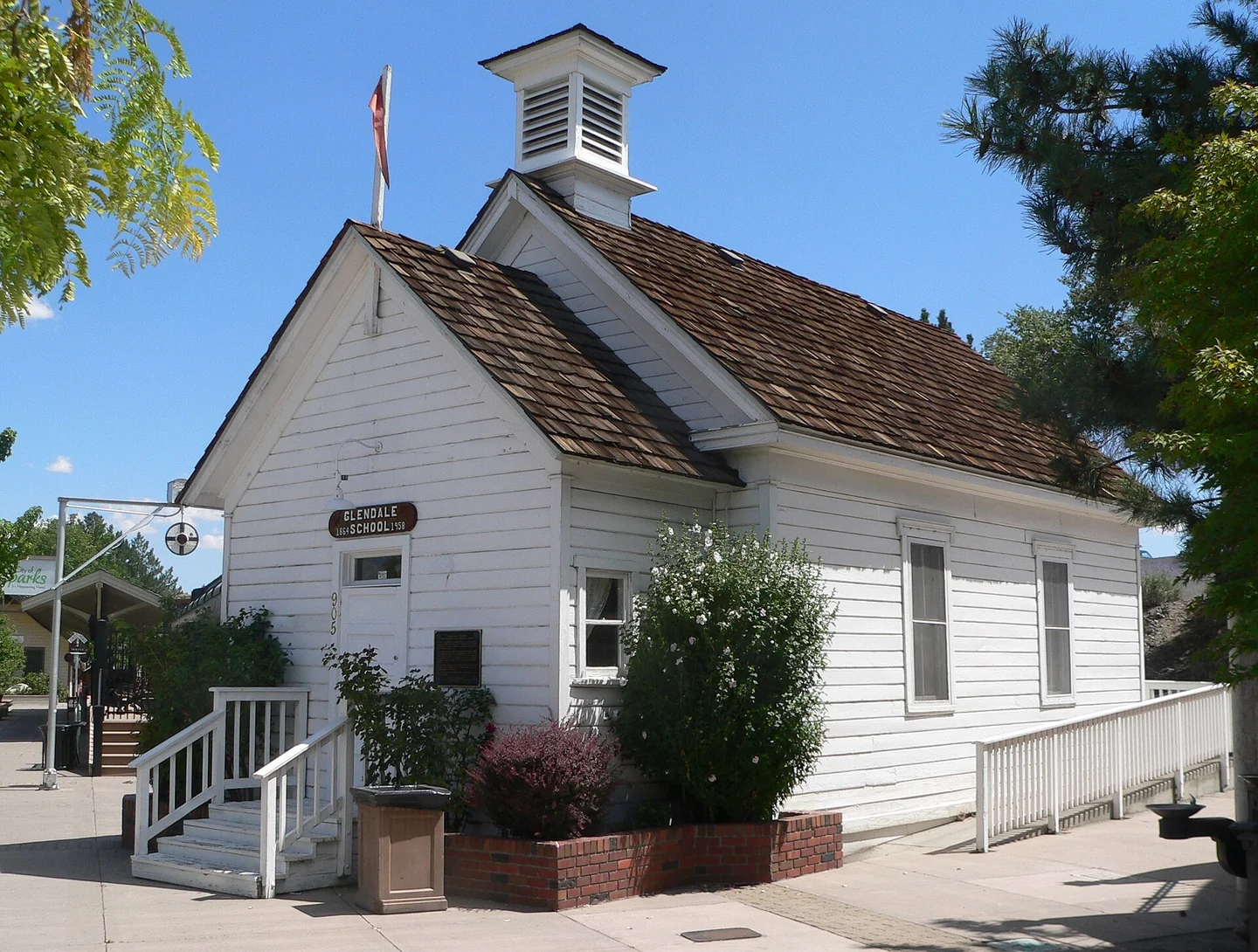 The white wooden Glendale School building at Victorian Square in Sparks