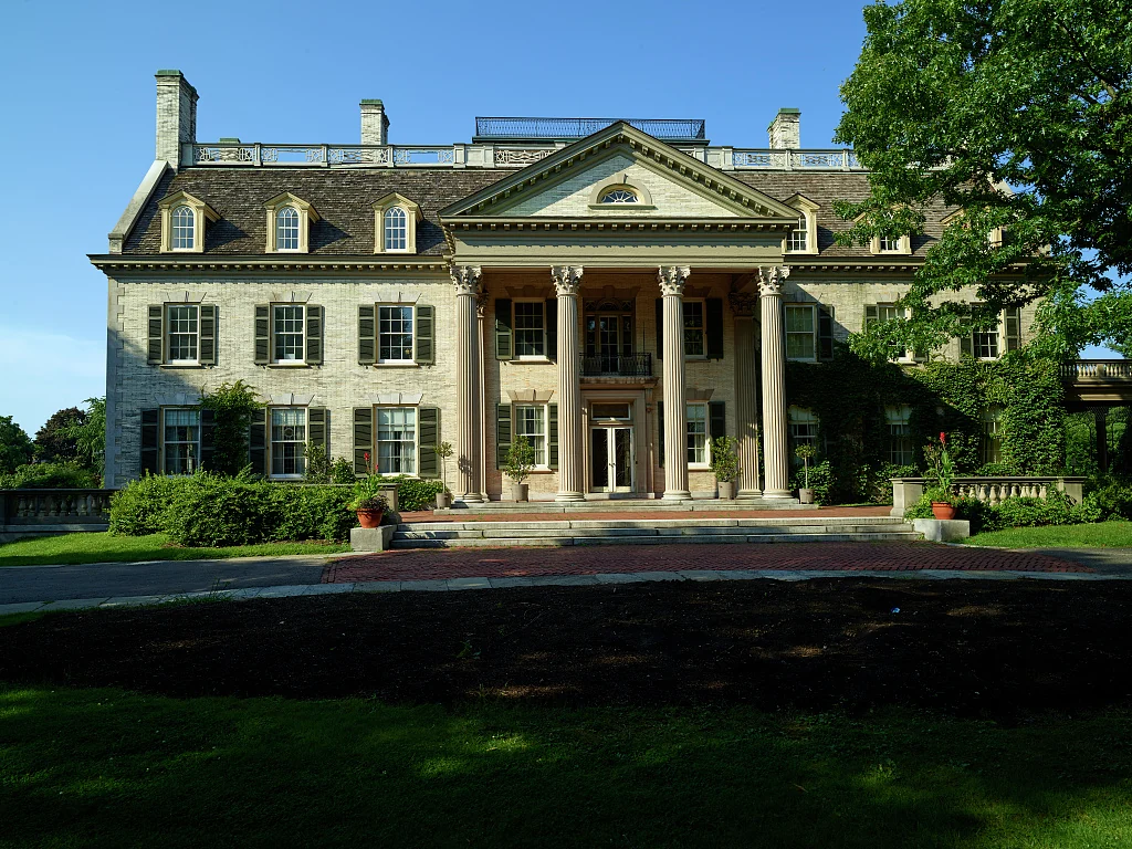 The columned entrance and landscaped grounds of George Eastman’s historic home in Rochester.