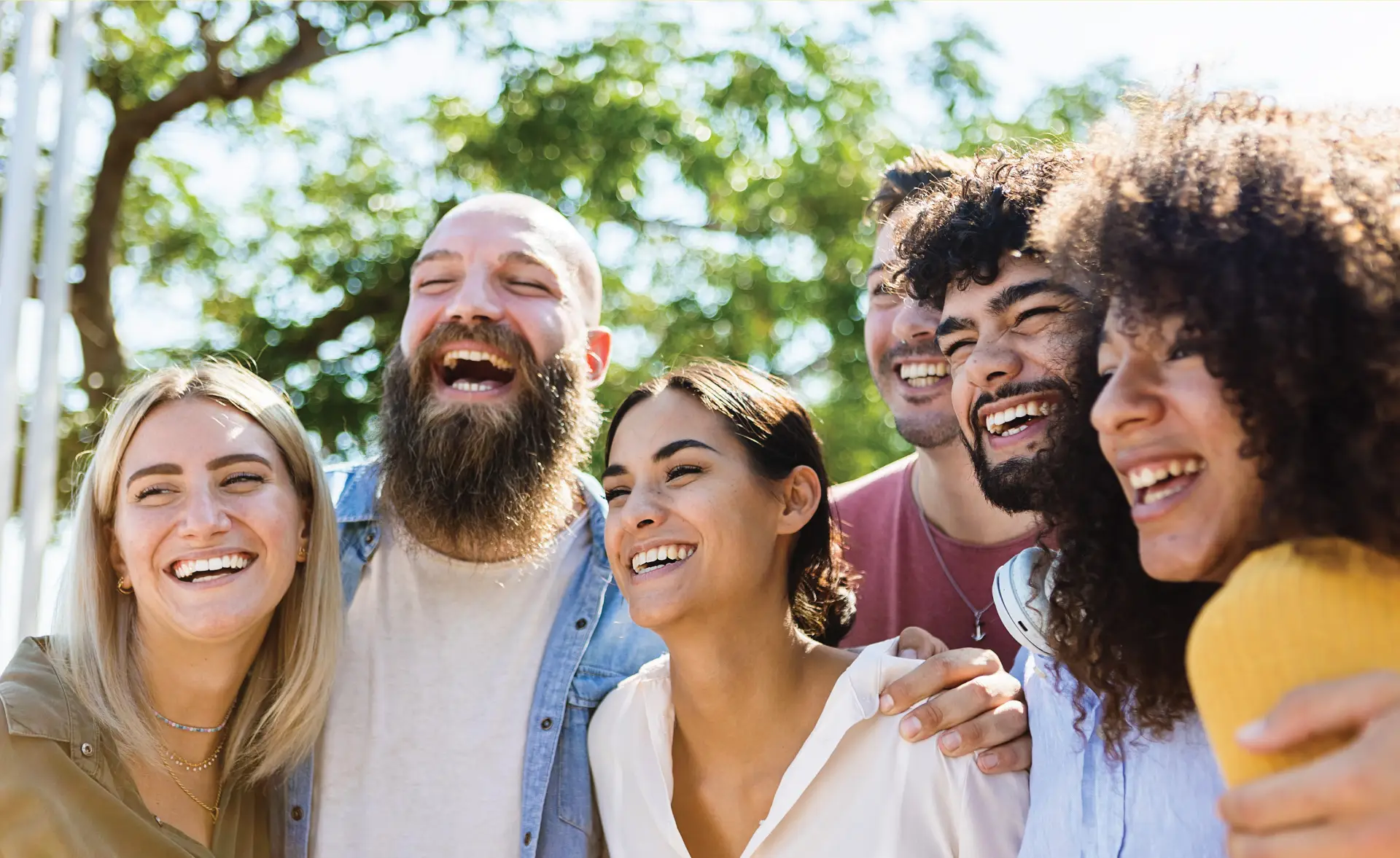 Friends laughing together outdoors